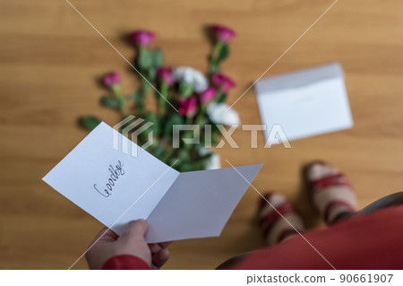 woman with paper letter and word goodbye on a floor. Heart broken concept. Copy Space woman with paper letter and word goodbye on a floor. Heart broken concept. Copy Space 90661907