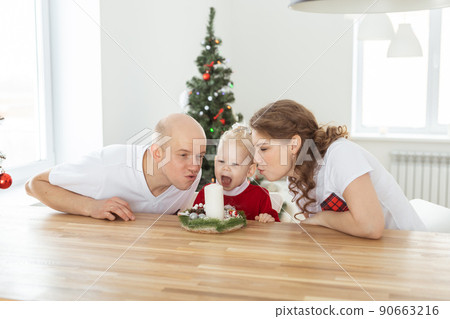 Baby child with hearing aid and cochlear implant having fun with parents in christmas room. Deaf , diversity and health concept 90663216