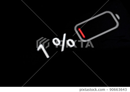 Smartphone charged battery level indicator - one, 1 percent: close up macro 90663643
