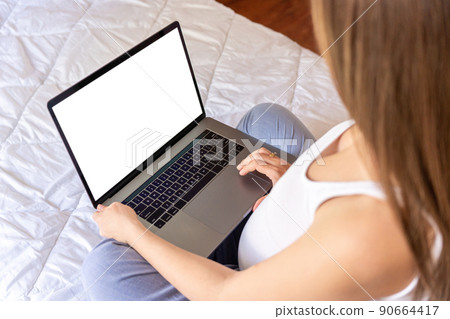 Pregnancy mockup display. Pregnant woman holding blank laptop screen. Mobile pregnancy online maternity notebook mock up. Concept maternity, pregnancy, childbirth. 90664417