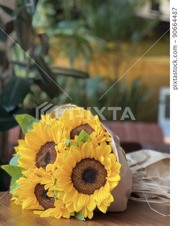 Beautiful bouquet of sunflowers on table indoors. Space for text. Beautiful bouquet of sunflowers on table indoors. Space for text. 90664487