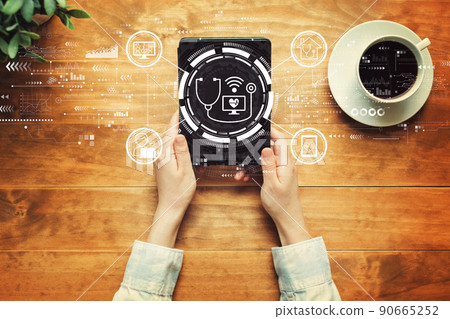 Telemedicine theme with a person holding a tablet 90665252