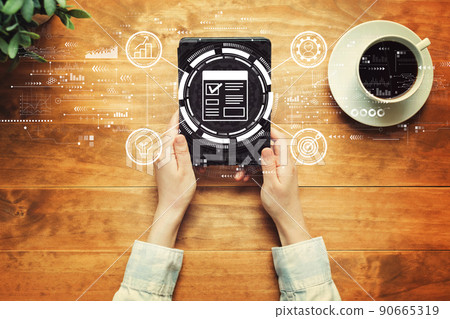 Project management theme with a person holding a tablet 90665319