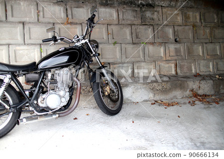 Image of a motorcycle with a season Image of a motorcycle with a season 90666134