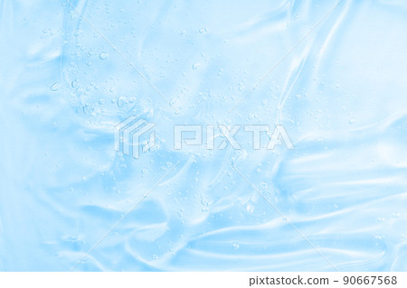 Liquid blue oil smudge. Hyaluronic acid clear serum sample. Aloe vera cosmetic gel texture with bubbles background. Skincare moisturizing product. Liquid blue oil smudge. Hyaluronic acid clear serum sample. Aloe vera cosmetic gel texture with bubbles background. Skincare moisturizing product. 90667568