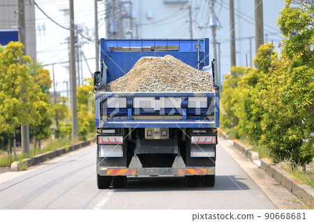 Image of a running dump truck 90668681
