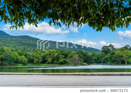 Asphalt black grey road landscape lake views at Ang Kaew Chiang Mai University in nature forest Mountain views spring blue sky background with white cloud. 90673173