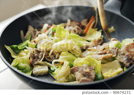Scene of frying pork and vegetables in a frying pan Scene of frying pork and vegetables in a frying pan 90674231