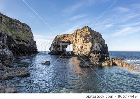Aerial view of the Great Pollet Sea Arch, Fanad Peninsula, County Donegal, Ireland 90677449