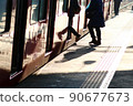 Passengers boarding the train 90677673
