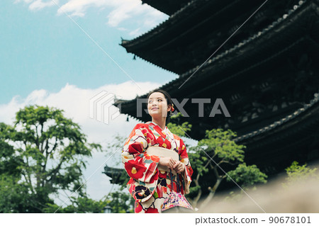 A young woman walking around Kyoto in a kimono A young woman walking around Kyoto in a kimono 90678101