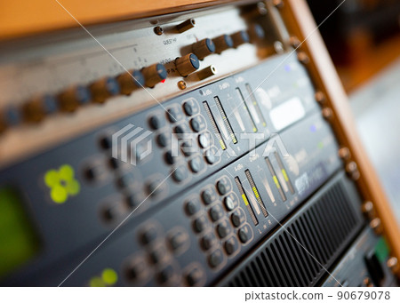 Equipment in the broadcasting room of a radio station 90679078