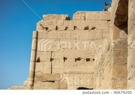 Different hieroglyphs on the walls and columns in the Karnak temple. Karnak temple is the largest complex in ancient Egypt. 90679200