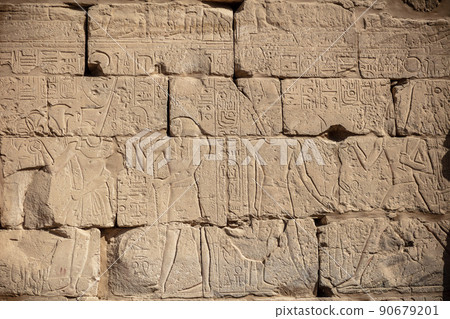 Different hieroglyphs on the walls and columns in the Karnak temple. Karnak temple is the largest complex in ancient Egypt. 90679201
