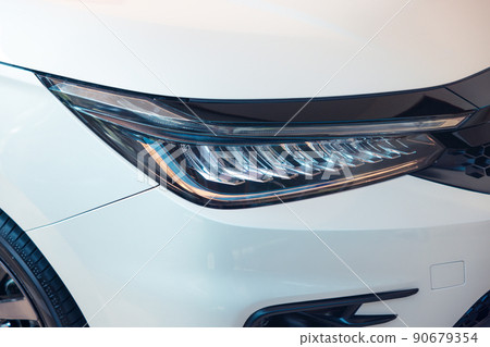 Closeup detail of headlight of auto car. Closeup detail of headlight of auto car. 90679354