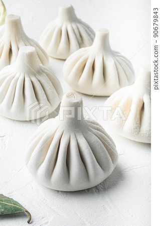 Manti, Turkish traditional ravioli, on white stone surface Manti, Turkish traditional ravioli, on white stone surface 90679843