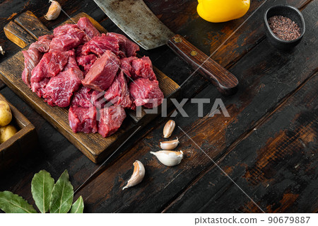 Beef chuck stew ingredients , on old dark wooden table , with copy space for text Beef chuck stew ingredients , on old dark wooden table , with copy space for text 90679887