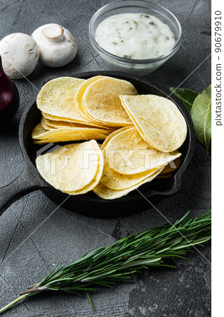 Home made potato chips, on gray stone background 90679910
