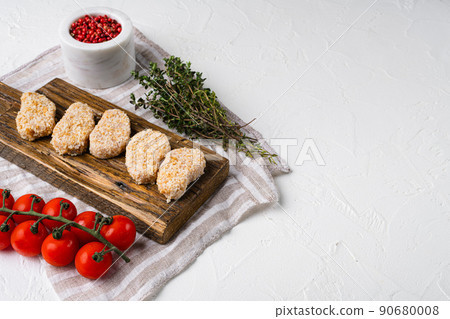 Chicken nuggets uncooked set, on white stone table background, with copy space for text Chicken nuggets uncooked set, on white stone table background, with copy space for text 90680008