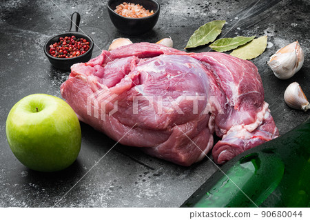 Pork roast ingredients, with apple dry cider, on black dark stone table background 90680044