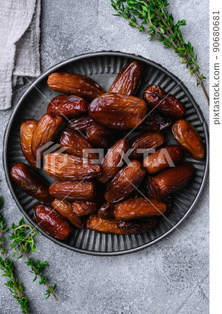 Ramadan dates is traditional food for iftar in islamic world set, on gray stone table background, top view flat lay 90680681