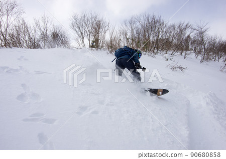 Snowboarder at Hakuba Cortina Ski Resort in Otari Village, Kita Azumino County, Nagano Prefecture Snowboarder at Hakuba Cortina Ski Resort in Otari Village, Kita Azumino County, Nagano Prefecture 90680858