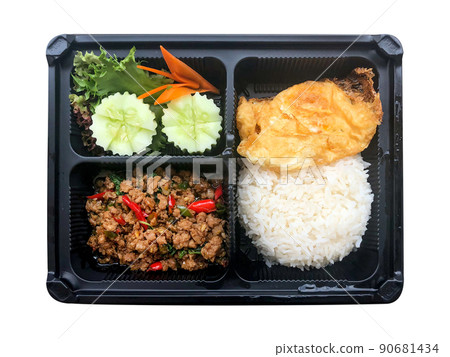 One of the most famous Thai food , Salted pork with chili and rice and fried egg in in the plastic box isolated on white background. One of the most famous Thai food , Salted pork with chili and rice and fried egg in in the plastic box isolated on white background. 90681434