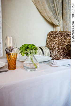 A restaurant in Marrakech, Morocco, with a table decorated with four-leaf clover and chairs with an exotic pattern A restaurant in Marrakech, Morocco, with a table decorated with four-leaf clover and chairs with an exotic pattern 90682150