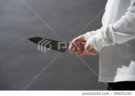 A woman who also has a kitchen knife A woman who also has a kitchen knife 90685282