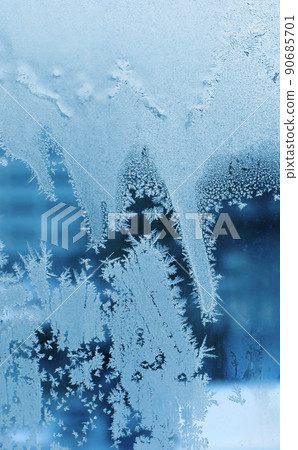 Beautiful ice pattern close-up on winter window glass 90685701