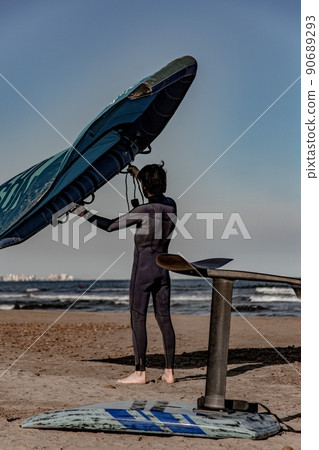 wing foil old kiter on the beach 90689293