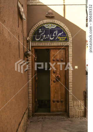 Entrance door on the corner of one of the ancient streets of the old adobe city of Yazd Entrance door on the corner of one of the ancient streets of the old adobe city of Yazd 90689332