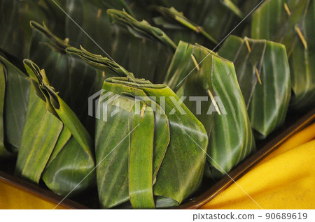 Tapai is a traditional food of the Malay community. Made from glutinous rice that is fermented and marinated over a period of time. Taste good. Wrapped with banana leaves 90689619