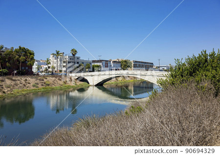 Sunny view of the landscape around the Venice Beach Canals Sunny view of the landscape around the Venice Beach Canals 90694329