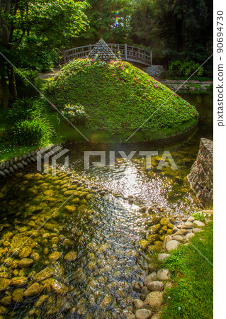 The pond with stone banks and some kind of azalea bushes pyramid and stream and japanese bridge and stream in P The pond with stone banks and some kind of azalea bushes pyramid and stream and japanese bridge and stream in P 90694730