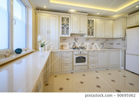 Classic white and beige large luxurious kitchen in studio apartment Classic white and beige large luxurious kitchen in studio apartment 90695062