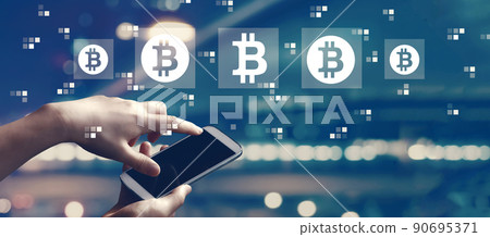 Bitcoin theme with person using smartphone Bitcoin theme with person using smartphone 90695371