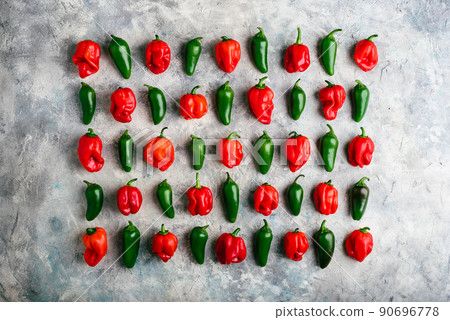 Jalapeno and Habanero Peppers on Concrete Surface Jalapeno and Habanero Peppers on Concrete Surface 90696778