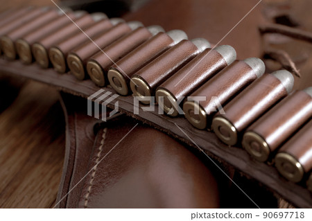Leather gun belt with ammnunitions and revolver in holster Leather gun belt with ammnunitions and revolver in holster 90697718