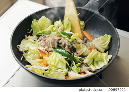 Stir-fried pork vegetables cooked in a frying pan 90697931