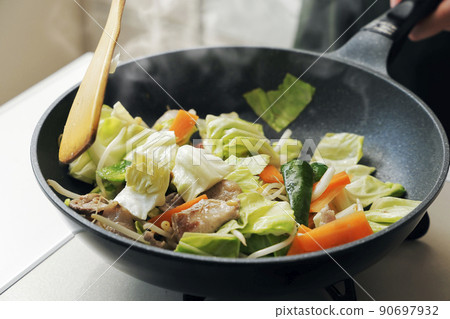 Stir-fried pork vegetables cooked in a frying pan Stir-fried pork vegetables cooked in a frying pan 90697932