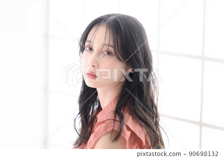 A woman with an ennui look looking back A woman with an ennui look looking back 90698132
