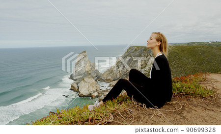 Sitting at the coast of Cabo da Roca in Portugal Sitting at the coast of Cabo da Roca in Portugal 90699328