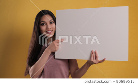 Young pretty woman holds a sign mock-up 90699513