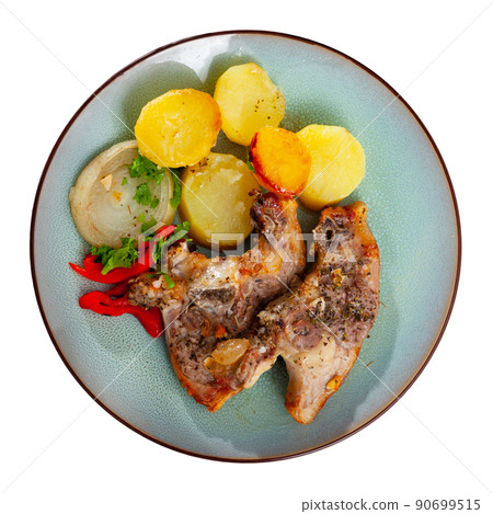 Side dish of baked lamb leg with potatoes and pepper 90699515