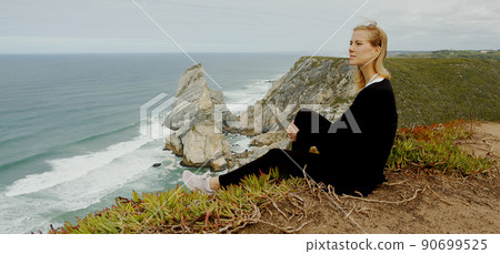 Sitting at the coast of Cabo da Roca in Portugal Sitting at the coast of Cabo da Roca in Portugal 90699525