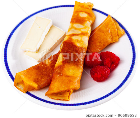 Pancakes with honey, raspberries and slices of cheese Pancakes with honey, raspberries and slices of cheese 90699658