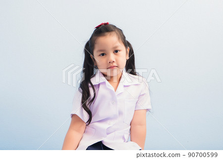 Happy cute girls in white medical uniform and stethoscope act like doctor. child dreams of becoming a doctor career concept 90700599