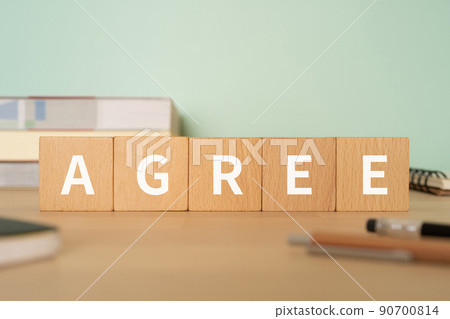 Image of consent | Desk with a block labeled "A GREE" Image of consent | Desk with a block labeled "A GREE" 90700814