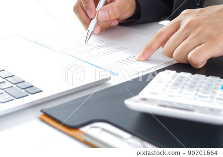 Hands of a man checking documents 90701664